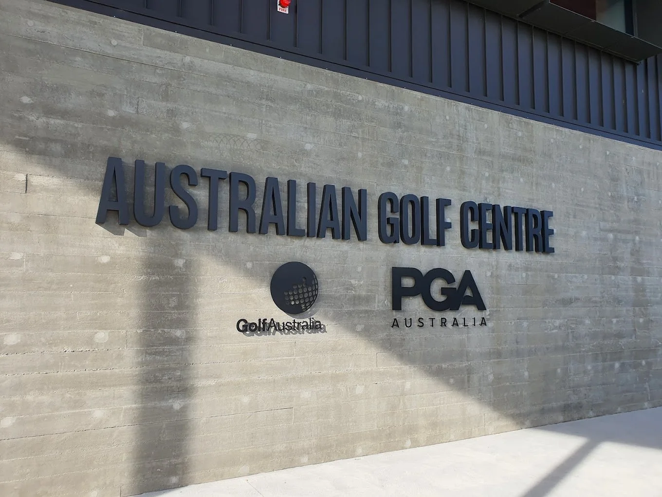 A modern golf administration building exterior seen in daylight