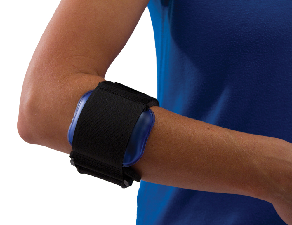 A tennis player tightening a counterforce forearm strap below the elbow while holding a racket on an outdoor court