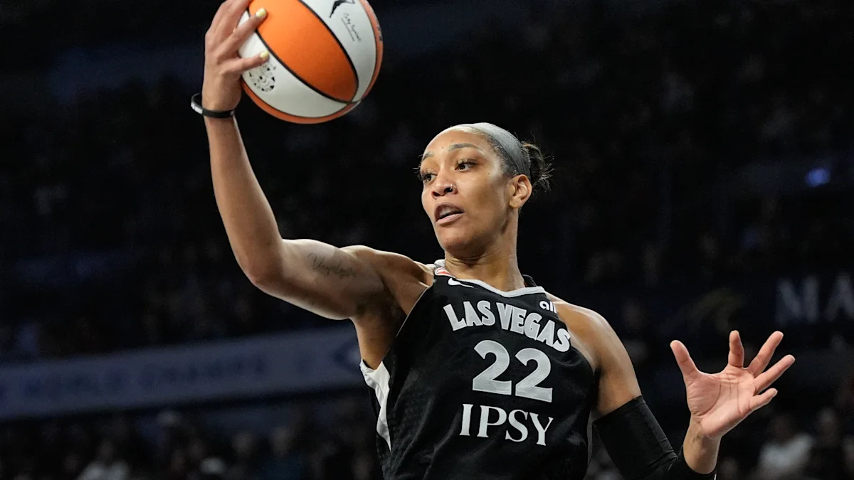 A'ja Wilson backing down a defender in the paint during a WNBA playoff game