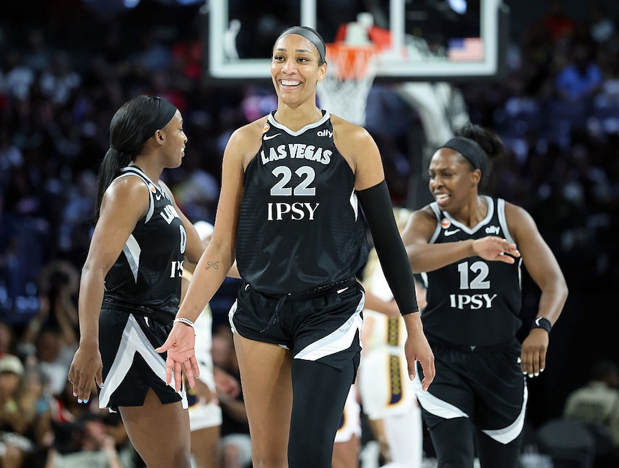 A'ja Wilson going up strong for a layup in a 2026 WNBA playoff game with defenders converging in the paint