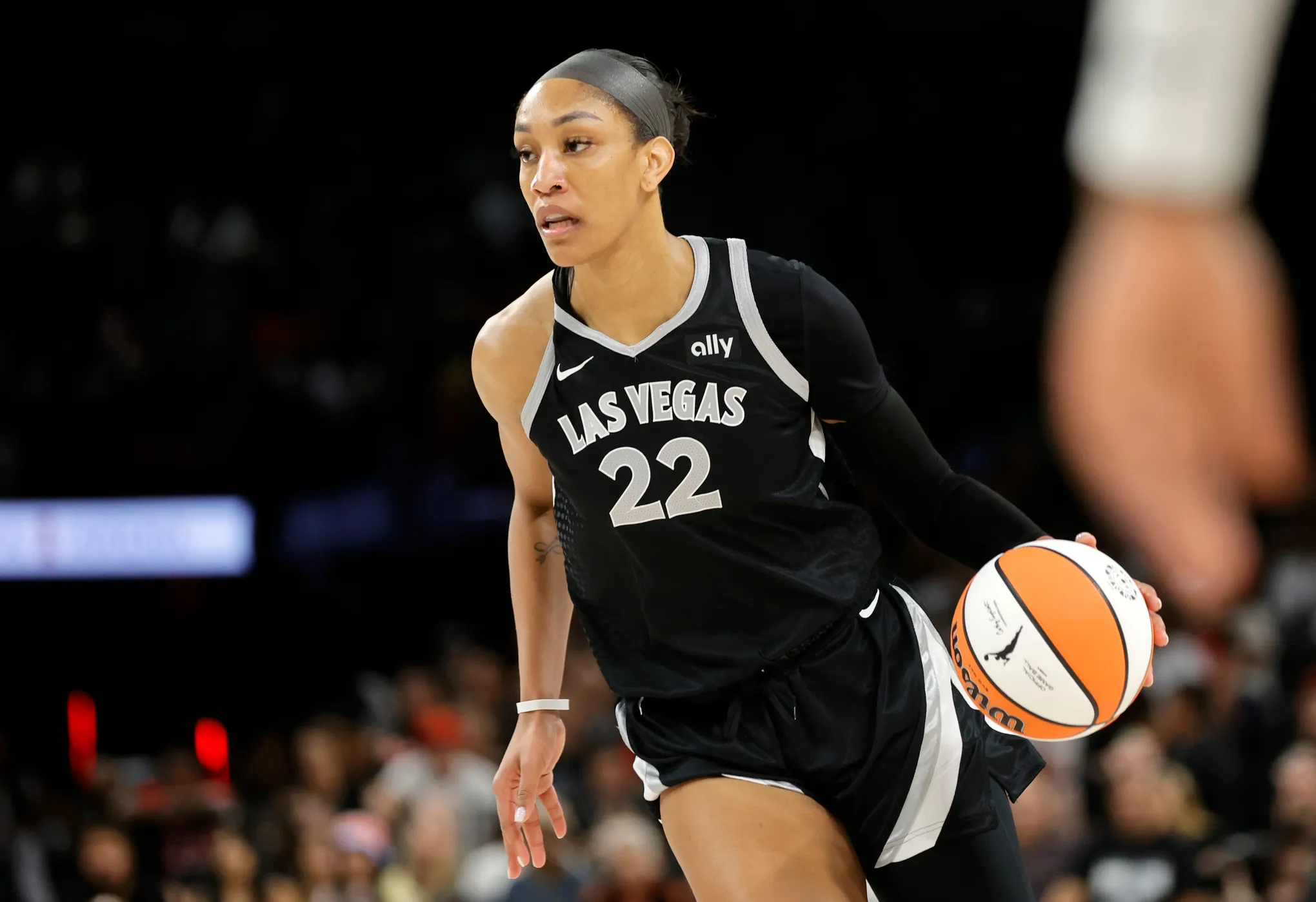 A'ja Wilson in a Las Vegas Aces uniform backing down a defender in the paint during a WNBA playoff game