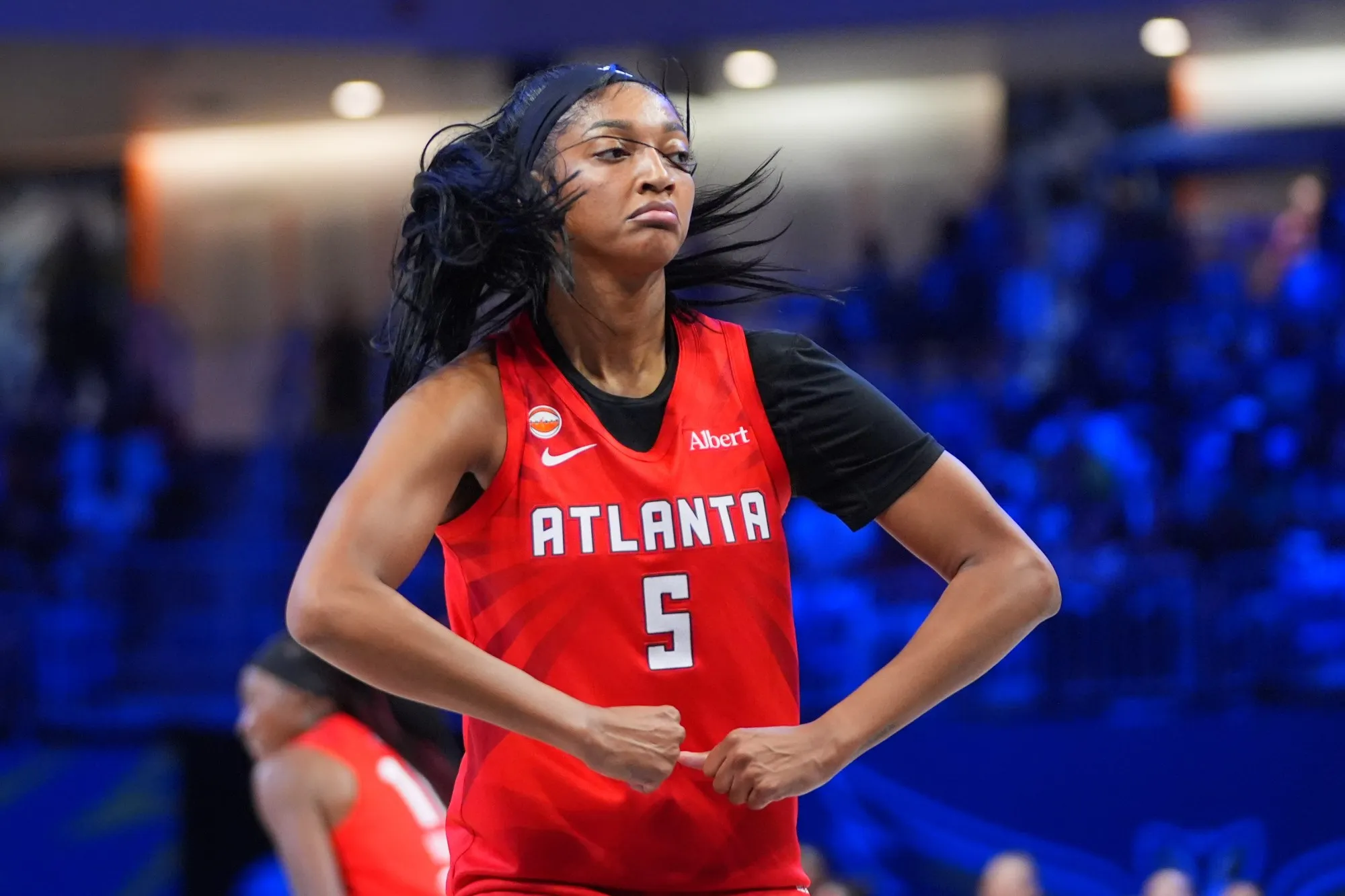Atlanta Dream forward Angel Reese grabbing a rebound in traffic during a 2026 WNBA playoff game