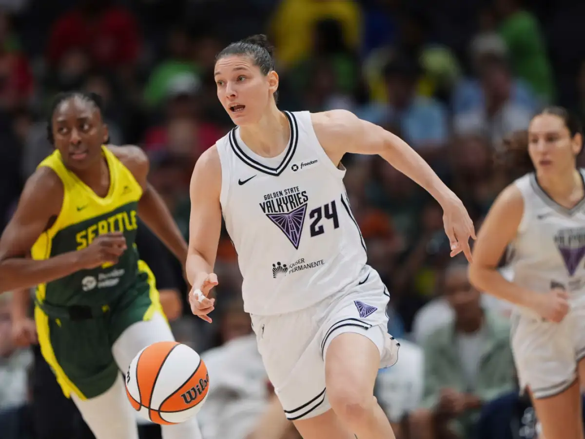 Cecilia Zandalasini rises into a jump shot during a WNBA playoff game as a defender closes out with a hand up.
