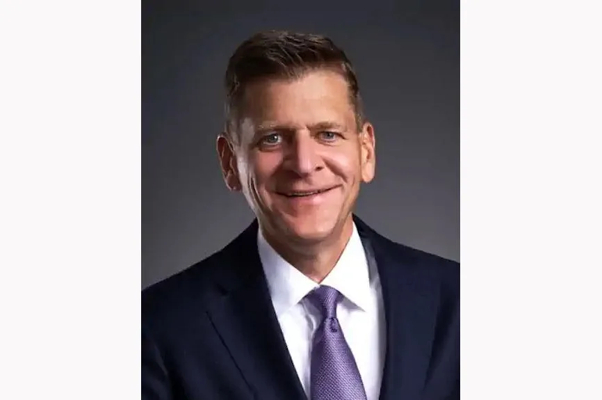 Chip Brewer, CEO of Callaway Golf, pictured at a golf industry event in 2026, standing near Callaway-branded equipment displays