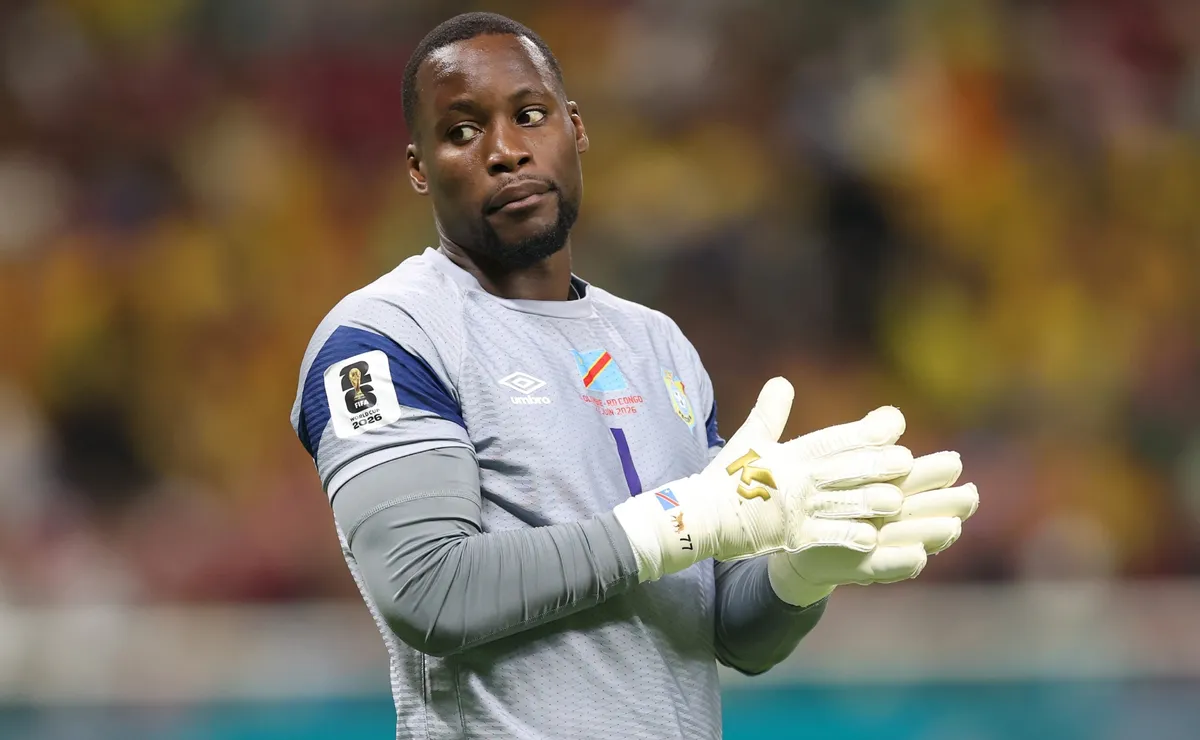 DR Congo goalkeeper Lionel Mpasi diving to make a save during the World Cup match against England in Atlanta