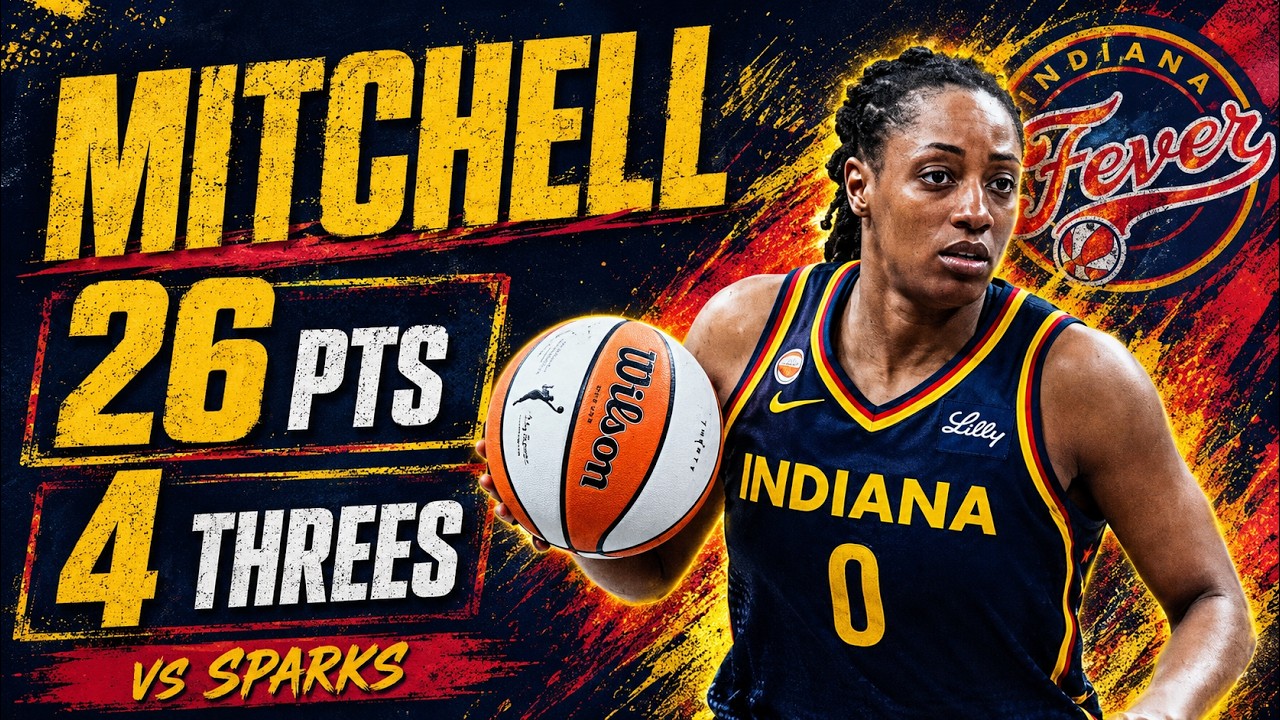 Indiana Fever guard Kelsey Mitchell dribbling into a pull-up jumper during a game against the Los Angeles Sparks, with defenders closing and the crowd visible behind the play