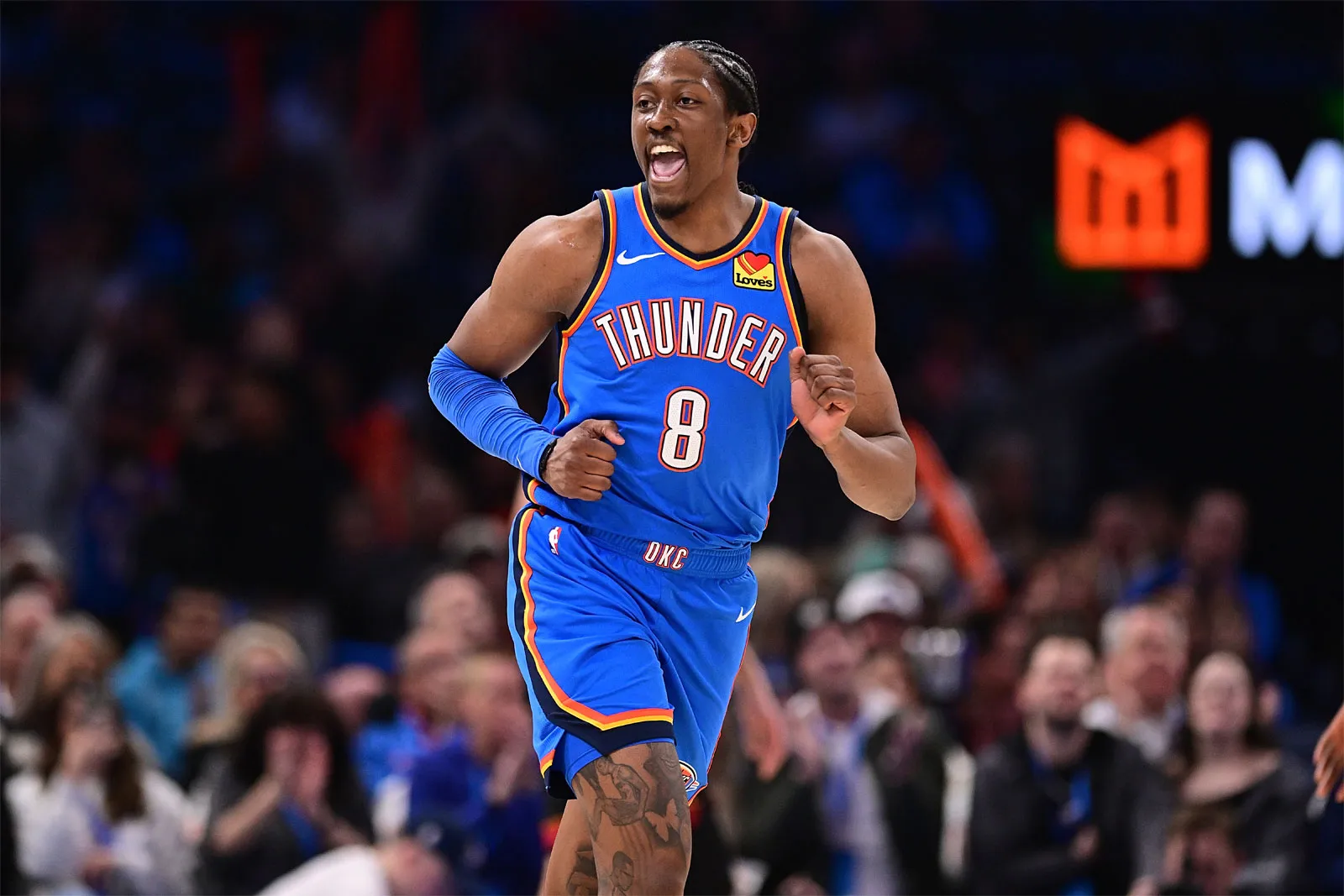 Jalen Williams in an Oklahoma City Thunder uniform driving toward the lane with the ball, reading a rotating defender