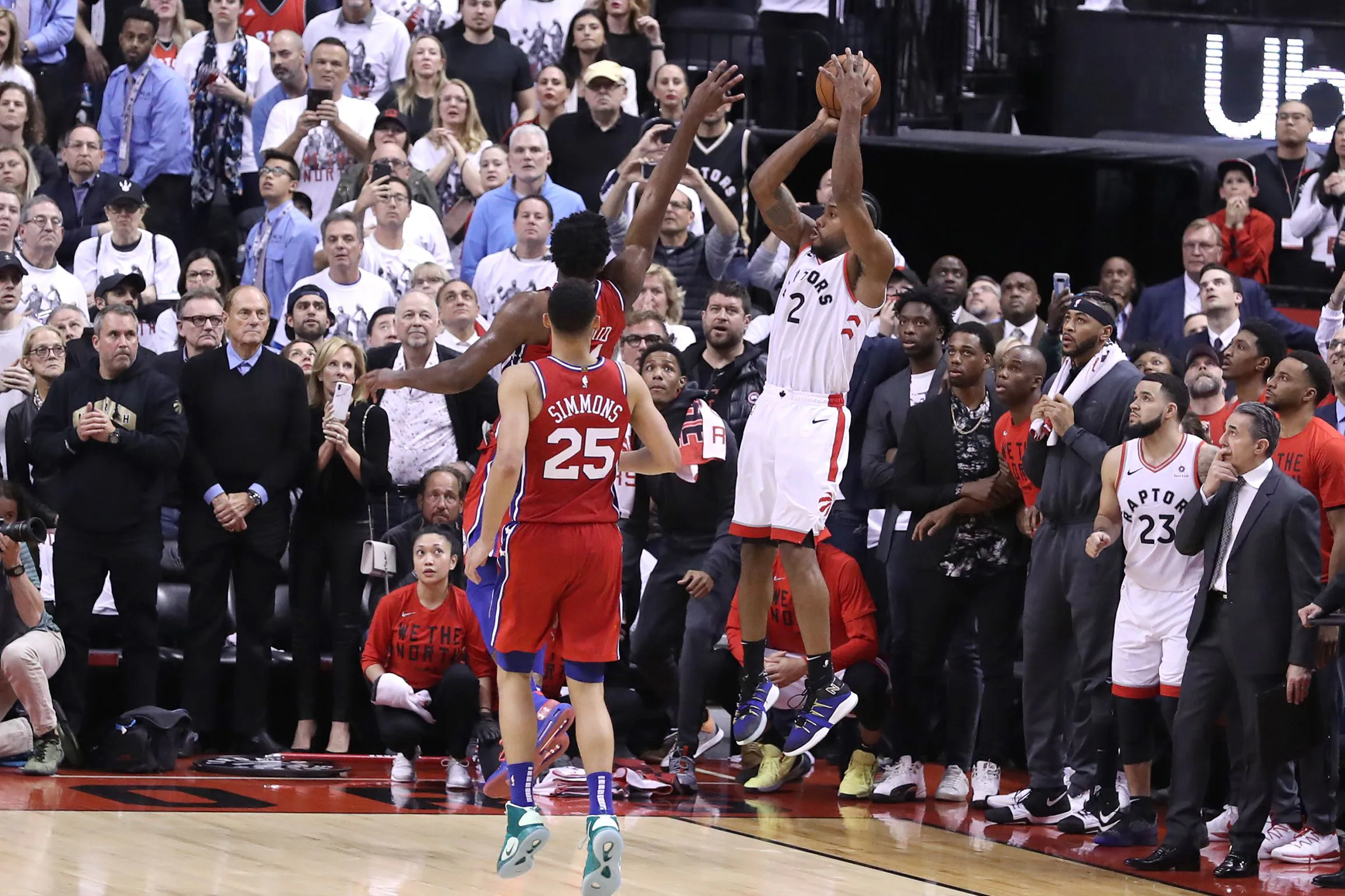 Kawhi Leonard watching his corner buzzer-beater bounce on the rim as players and fans hold their breath in Game 7