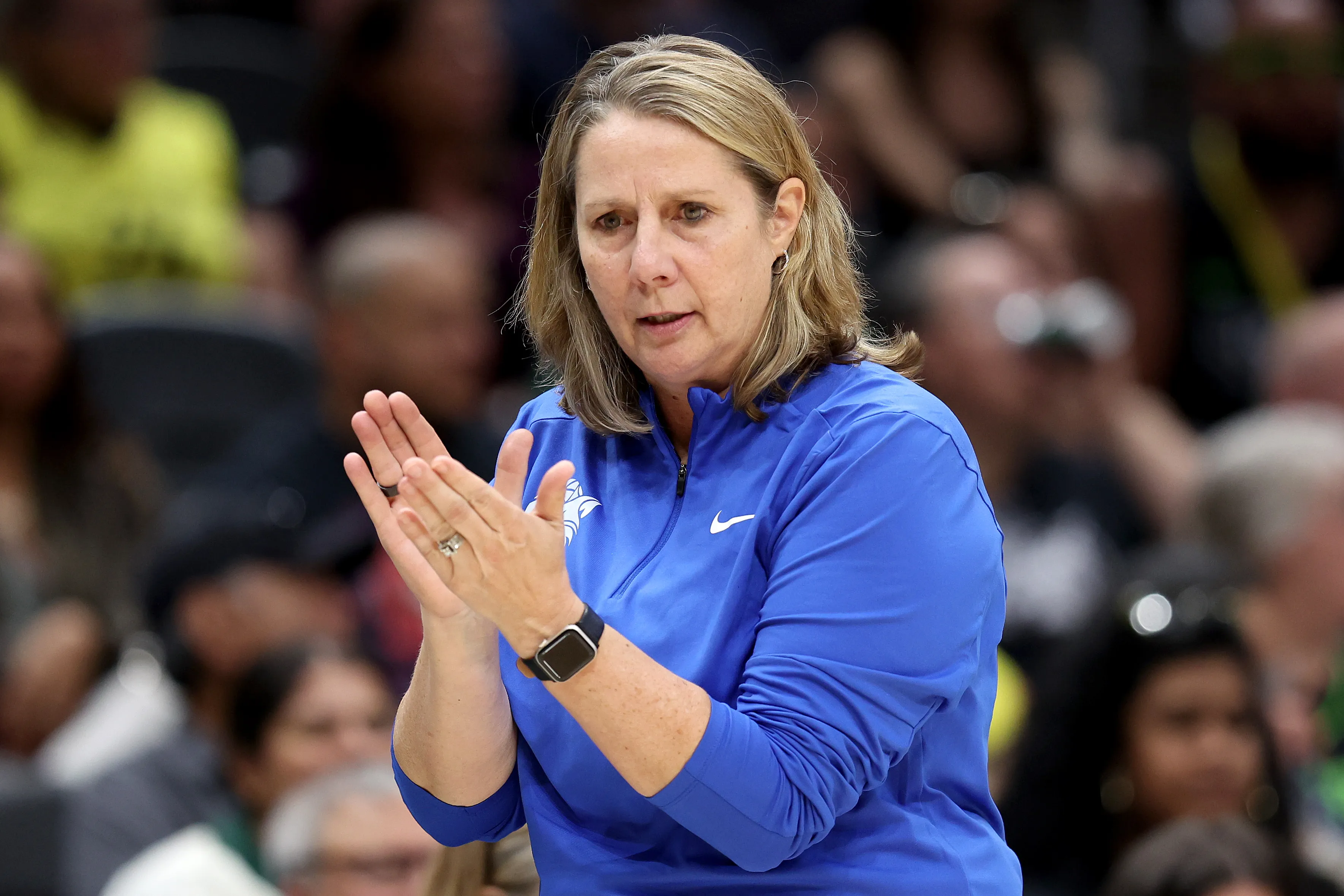 Minnesota Lynx head coach Cheryl Reeve signaling a play from the sideline during a 2026 WNBA playoff game