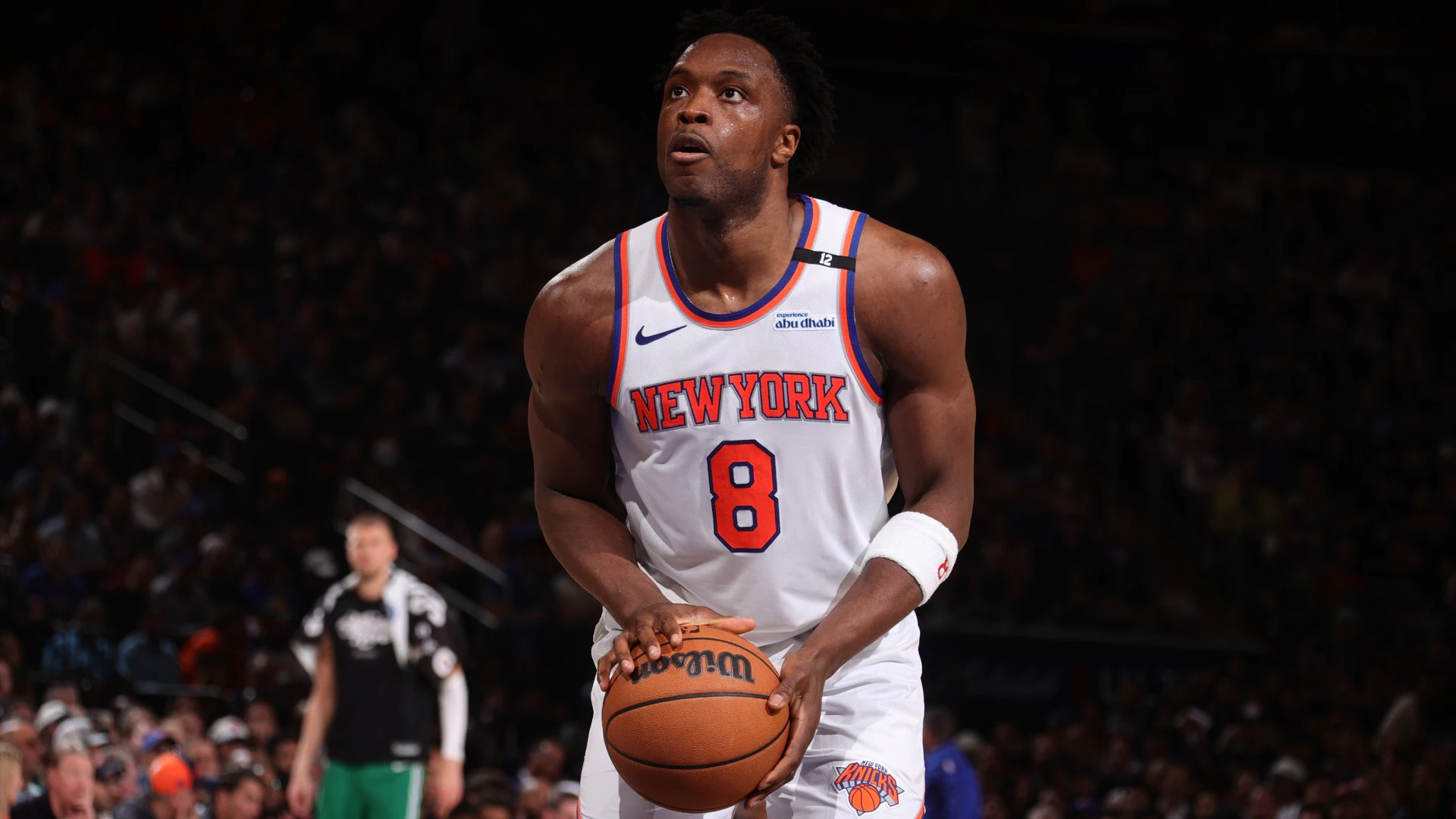 OG Anunoby in a New York Knicks uniform defending on the perimeter during an NBA game