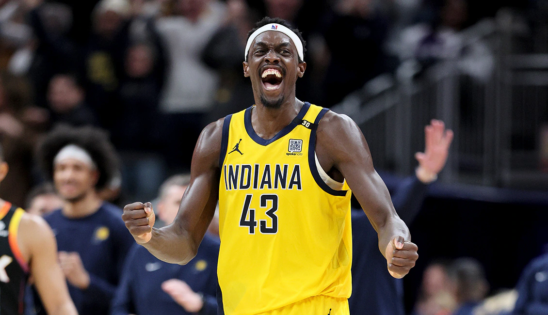 Pascal Siakam in an Indiana Pacers uniform during live play, surveying the floor with teammates spaced around him