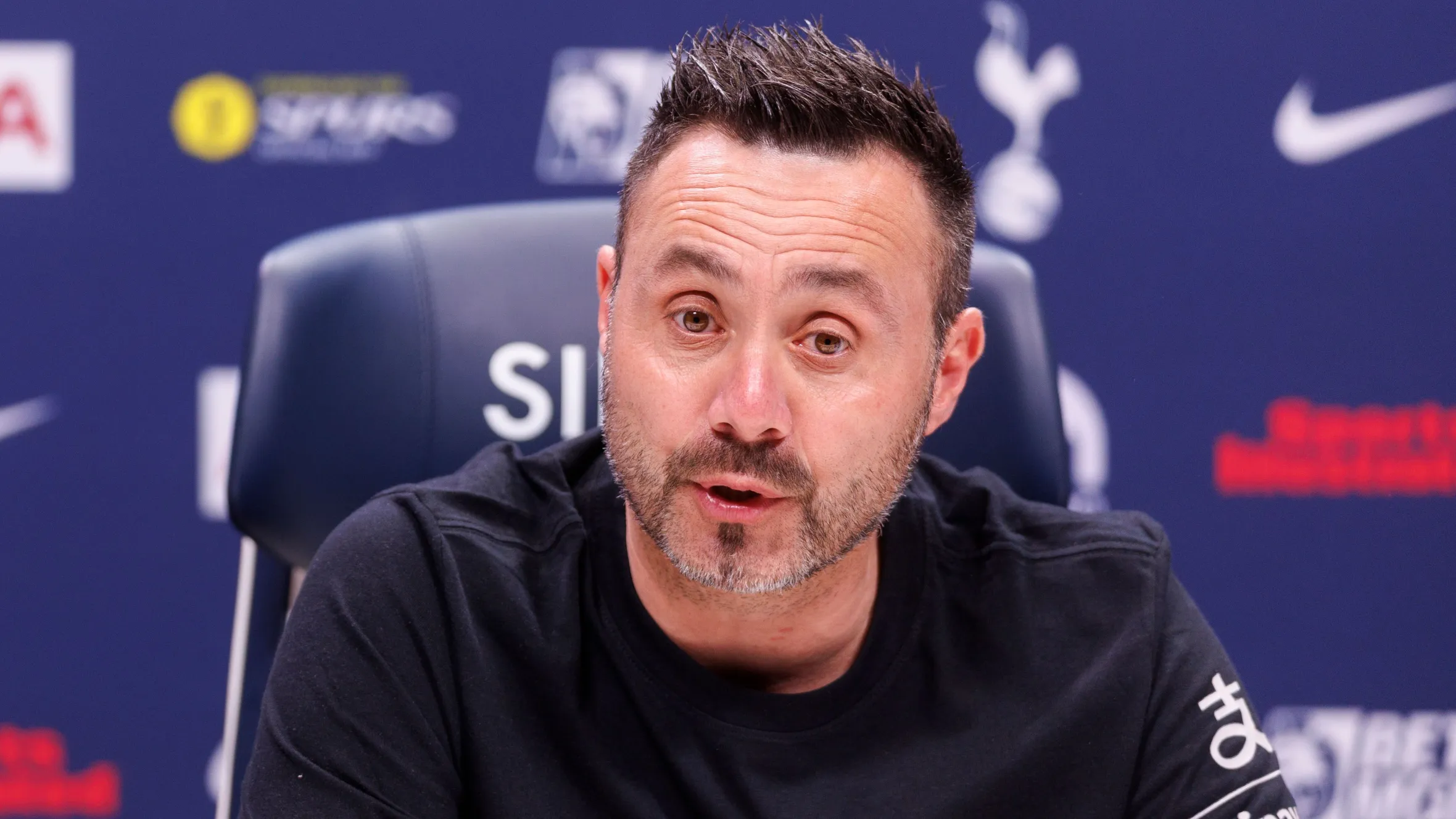 Roberto De Zerbi on the touchline in Tottenham gear watching play and giving instructions