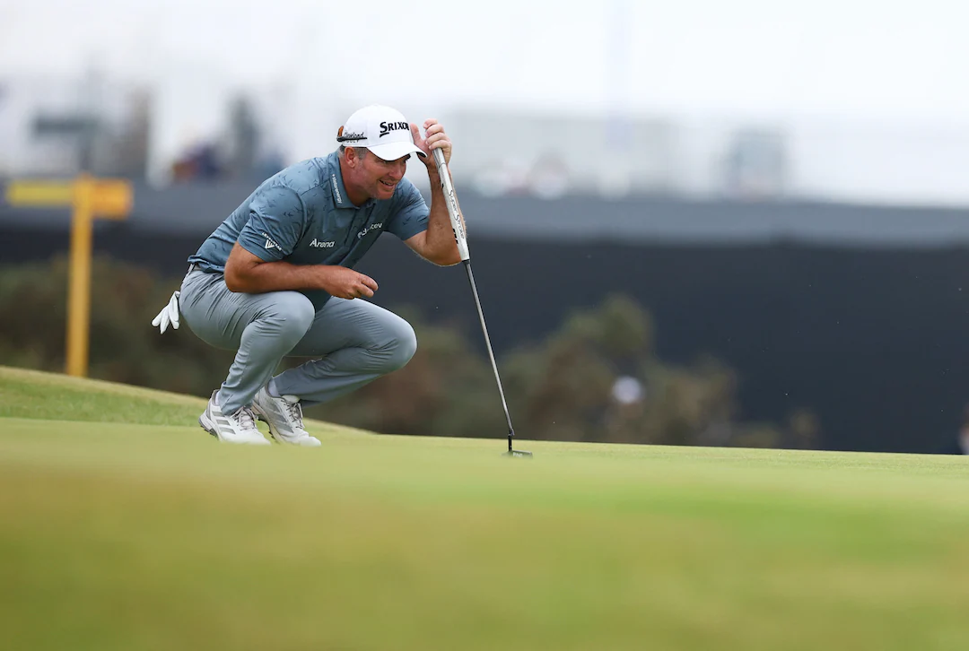 Ryan Fox walking up a fairway at Royal Birkdale during the 2026 Open Championship, holding his putter and looking toward the green as spectators line the ropes