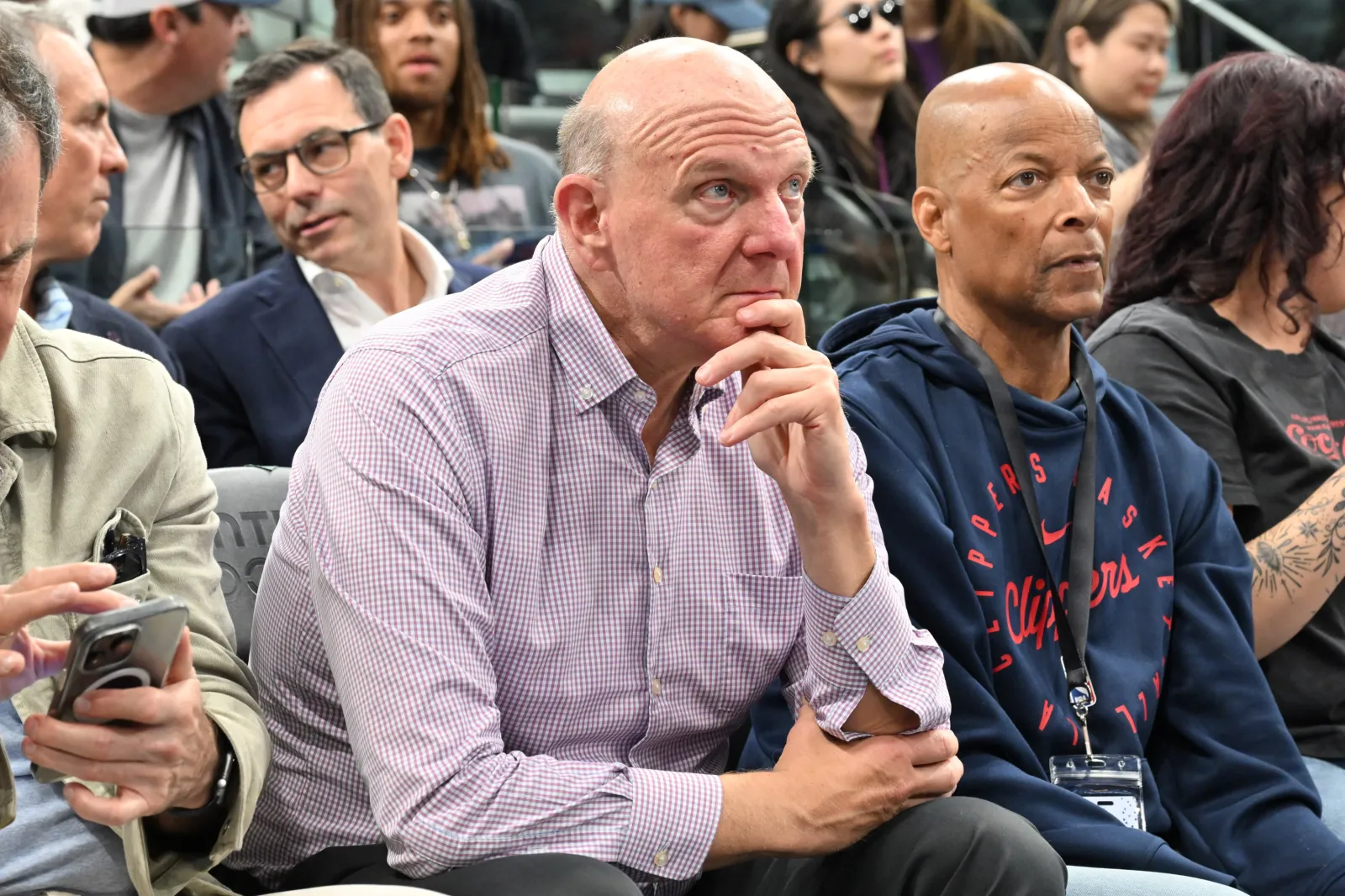 Steve Ballmer sitting courtside at a Los Angeles Clippers home game, reacting to the action on the court