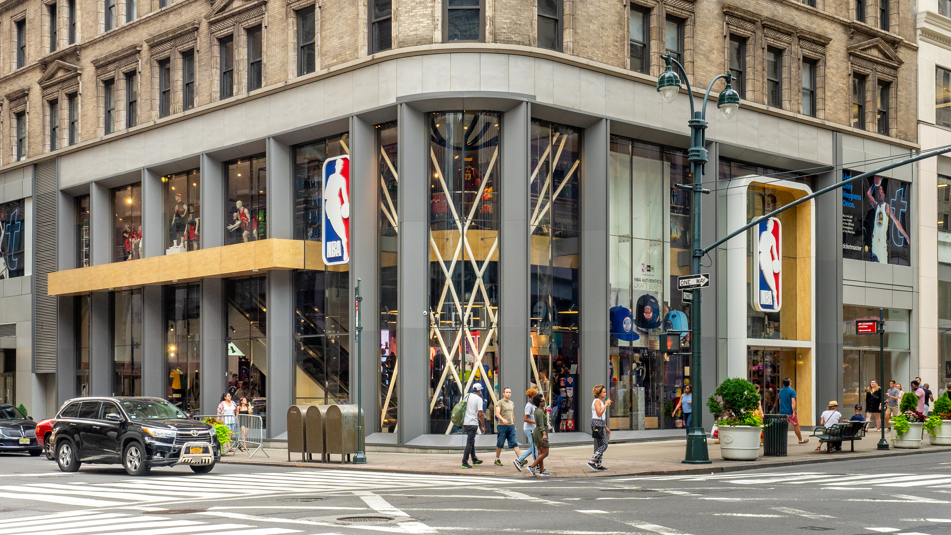 The exterior of the NBA league office building in New York City on a clear day, photographed from street level